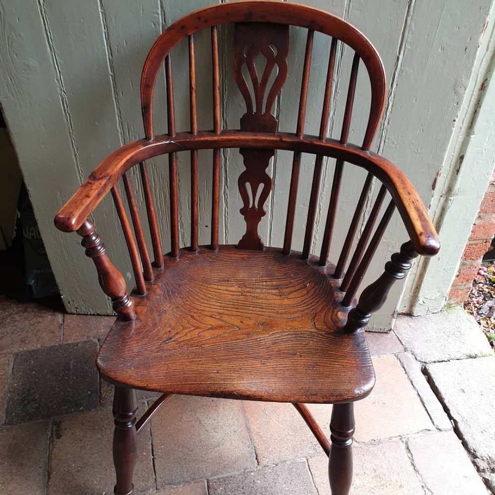 good antique yew wood windsor armchair with a crinoline stretcher c1830