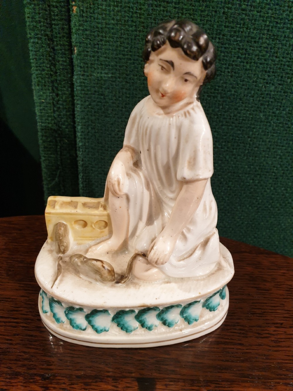 early19thc staffordshire figure of boy playing with micerats
