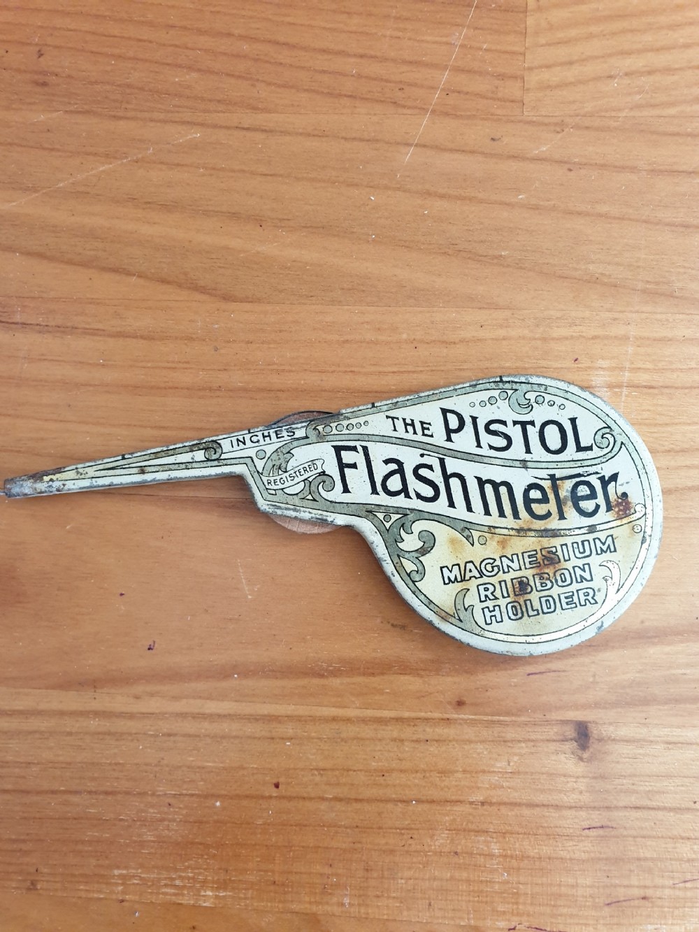 a tin plate pistol flash meter magic lamp lighter