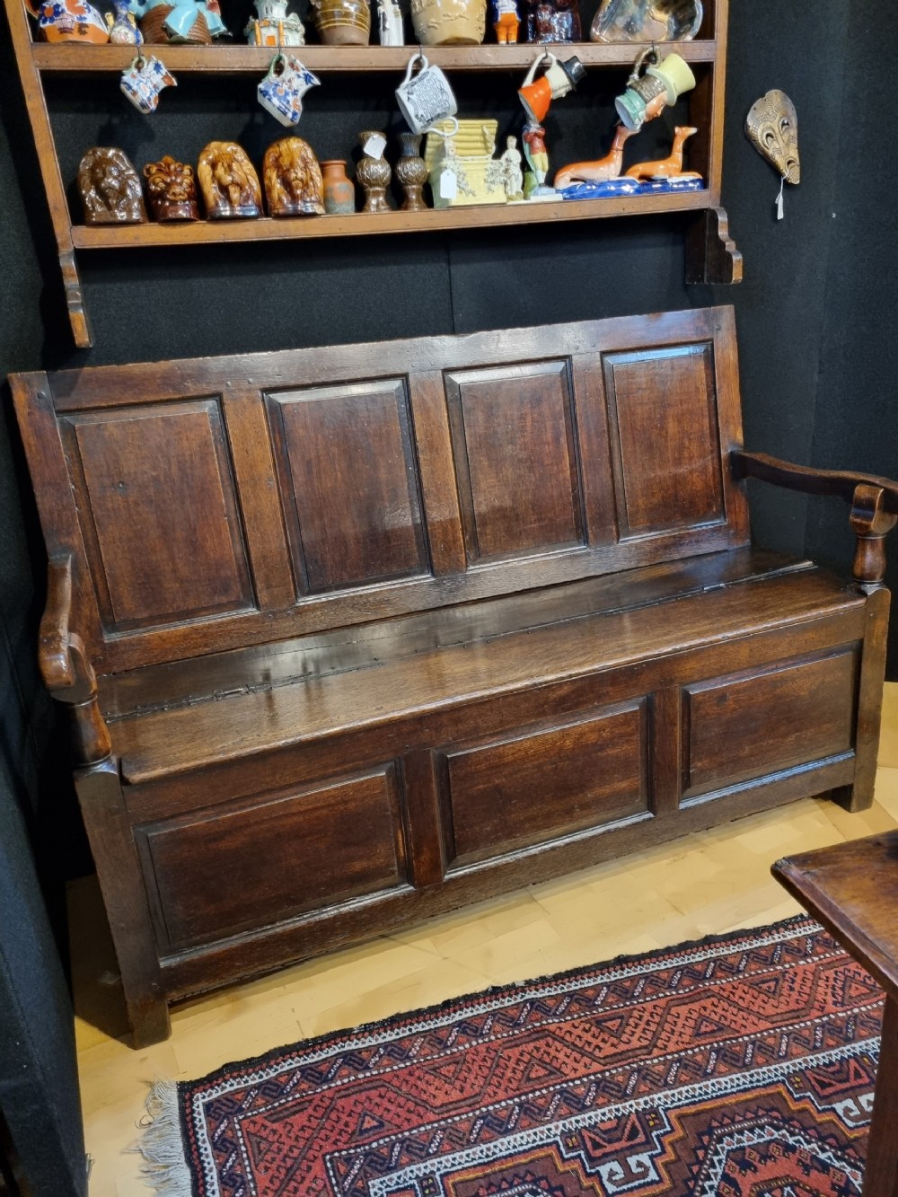 18th century box settle seat in oak with ample storage