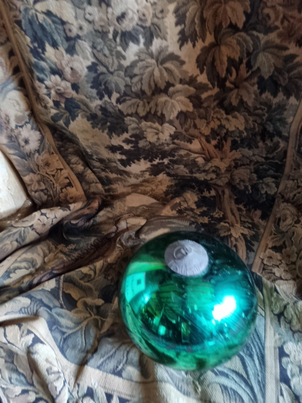 a large 19c green glass witches ball with original hook