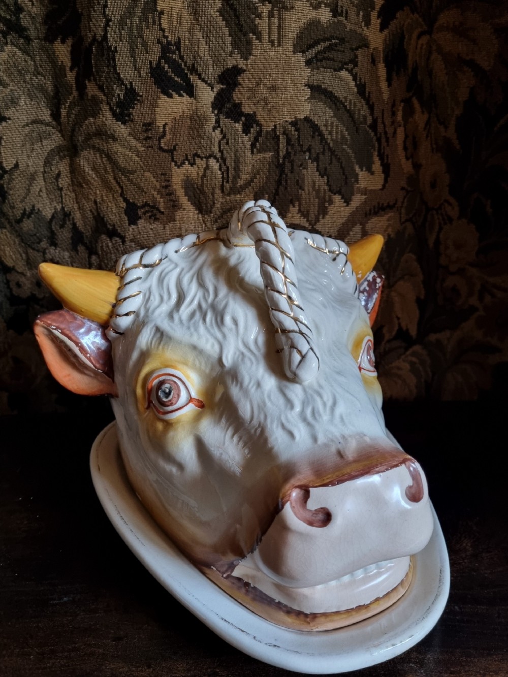 a large antique pottery cows head tongue dish and cover