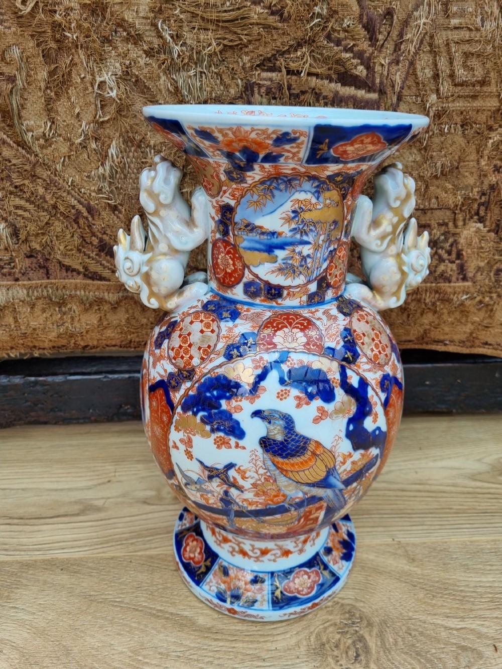 a large perfect 19thc imari vase with dogs of fo handles meiji period