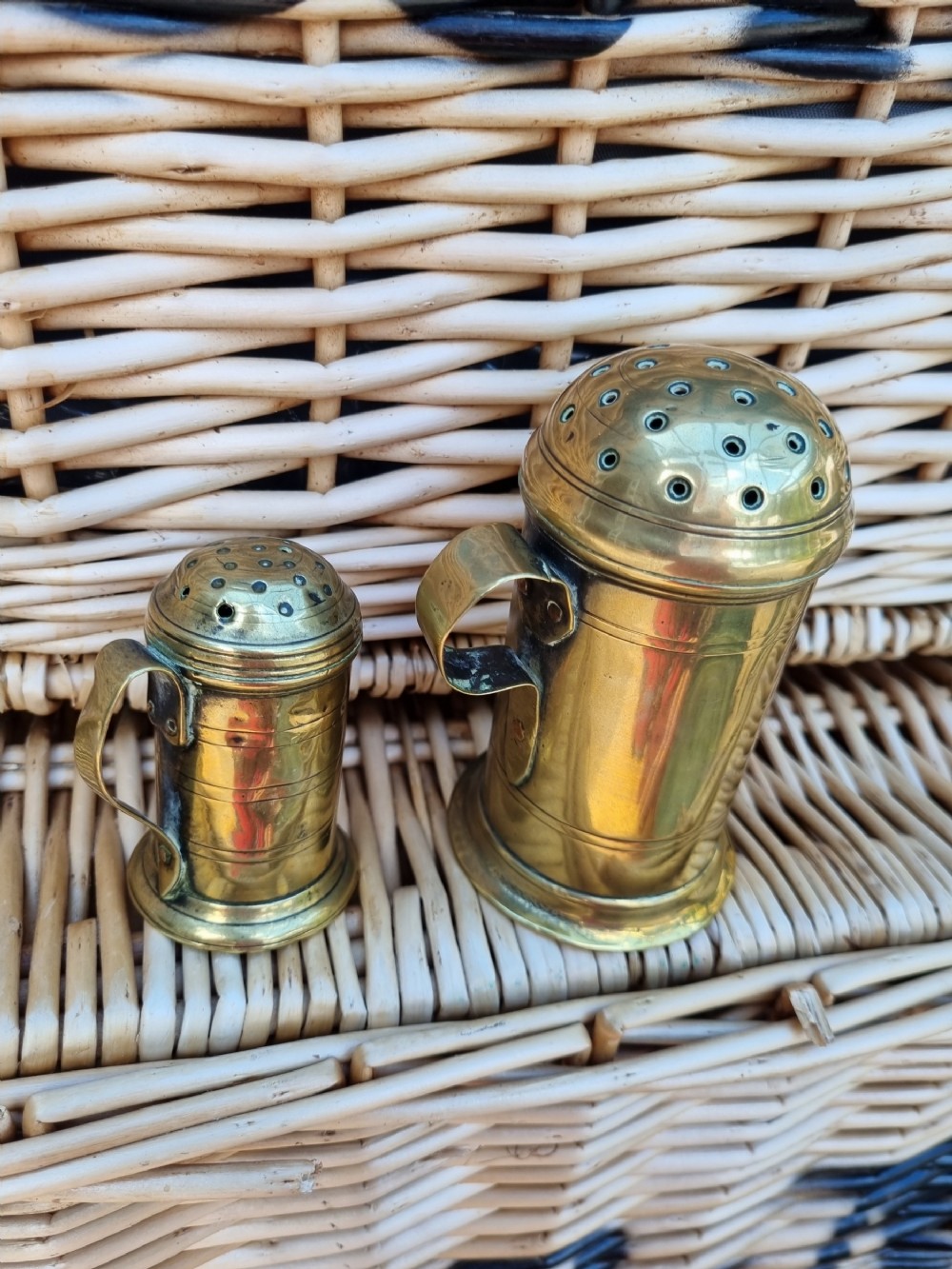 2 good 18thc brass shakers muffineers