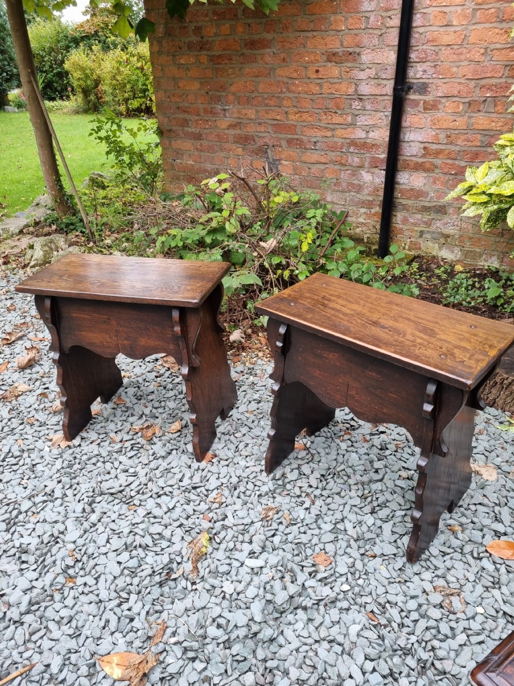 a near pair of substantial antique coffin stools