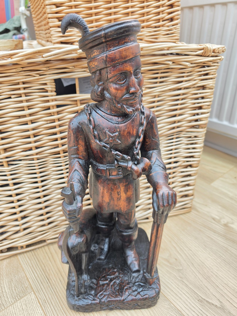 large black forest carved figure of a hunter and dog